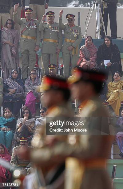 Pakistani Army officers cheer for President Pervez Musharraf and their new army chief Gen. Ashfaq Kayani at a change of command ceremony November 28,...