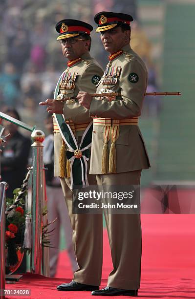 President Pervez Musharraf and the new Pakistani army chief Gen. Ashfaq Kayani watch as troops pass by during a change of command ceremony November...