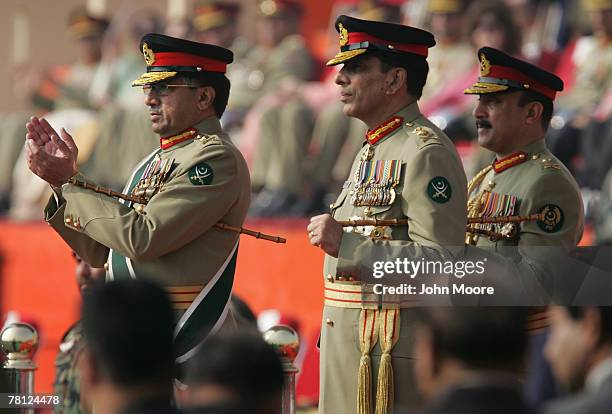 President Pervez Musharraf and the new Pakistani army chief Gen. Ashfaq Kayani watch as troops pass by during a change of command ceremony November...