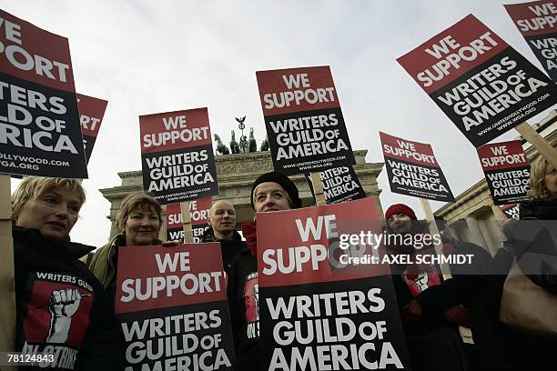 German scriptwriters demonstrate 28 November 2007 in front of Berlin's Brandenburg Gate to support their colleagues in the US. The Writers Guild of...