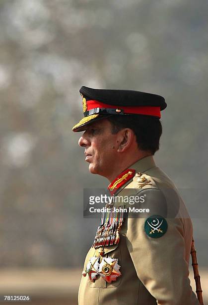 New Pakistani military chief Gen. Ashfaq Kayani watches as troops pass by during a change of command ceremony November 28, 2007 in Rawalpindi,...