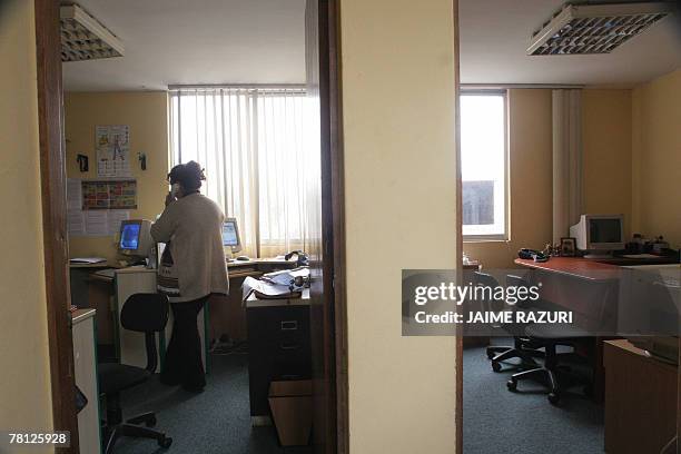 Ynes, an HIV-positive ex-prostitute, works at an NGO office June 2007, in Lima. Ynes leads an association of prostitutes HIV-positive. Ynes was...