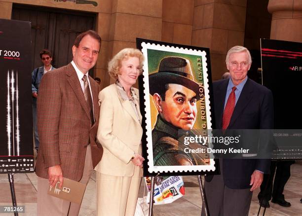 Actors Rich Little, Nanette Fabray and Charlton Heston unveil the Edward G. Robinson postage stamp during a ceremony where the late actor was honored...