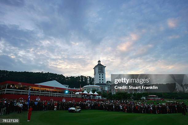 Spectators watch the closing ceremony after the final round of the Omega Mission Hills World Cup at the Mission Hills Golf Resort on November 25,...