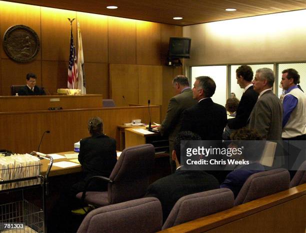 Defendants, Jorg Halaby, Brockovich's ex-boyfriend, from left behind counsel, John Reiner, and Shawn Brown, Brockovich's ex-husband, appear before...