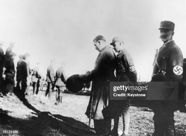 Nazi leader Adolf Hitler with his personal bodyguard Ulrich Graf and Gerhard Rossbach at a meeting of the party's paramilitary wing, the SA, on on...