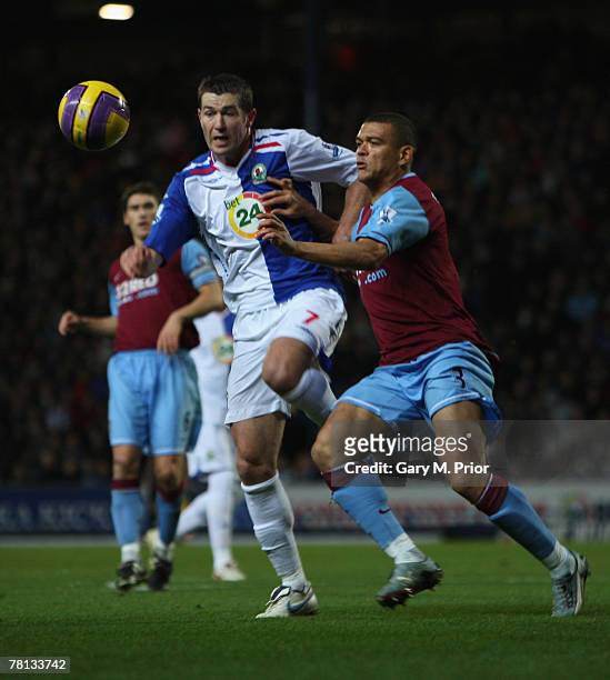 Brett Emerton of Blackburn Rovers and Wilfred Bouma of Aston Villa in action during the Barclays Premier League match between Blackburn Rovers and...