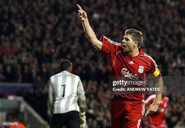 Steven Gerrard of Liverpool celebrates after scoring the third goal during the Uefa Champions League football match against Porto at Anfield,...