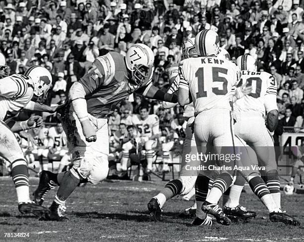 Defensive tackle Ernie Ladd of the San Diego Chargers pressures Buffalo quarterback Jack Kemp in a 23-0 loss to the Bills in the 1965 AFL...
