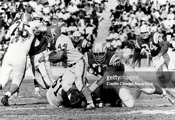 San Diego Chargers defensive tackle Ernie Ladd lunges for Houston Oilers running back Charlie Tolar during a 27-0 Chargers victory on December 1 at...