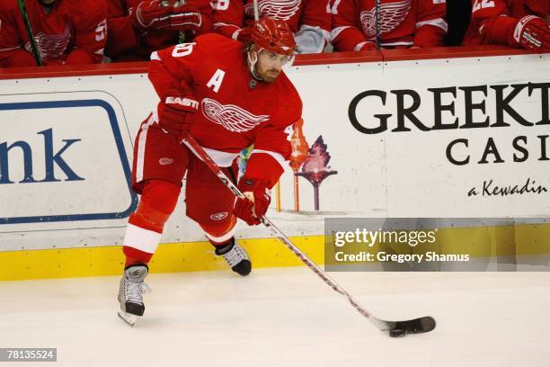 Henrik Zetterberg of the Detroit Red Wings moves the puck against the St. Louis Blues on November 21, 2007 at Joe Louis Arena in Detroit, Michigan.