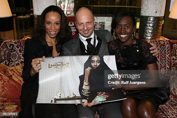 Nubya, photographer Kai Stuht von Neupauer and Khadija pose during the presentation of the new "lambertz-calendar" on November 28, 2007 at the...