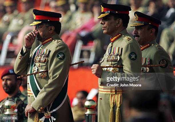 Pakistani President Pervez Musharraf wipes his nose after an emotional speech to military forces at a change of command ceremony along with the new...