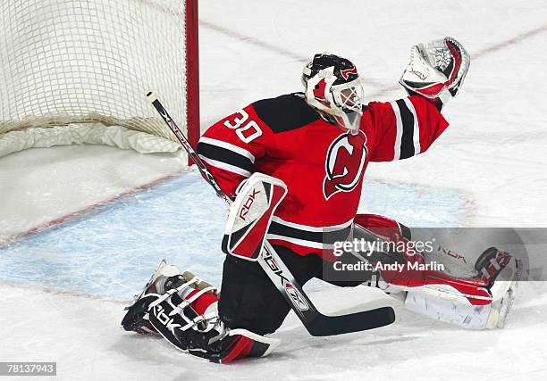 Martin Brodeur of the New Jersey Devils makes a glove save against the Dallas Stars during their game at the Prudential Center on November 28, 2007...