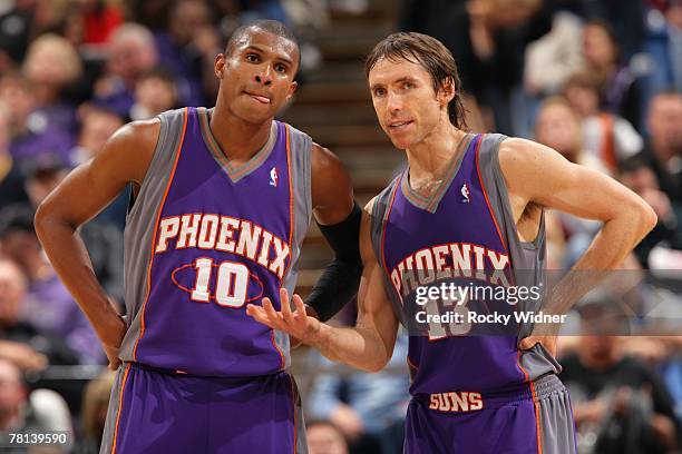 Leandro Barbosa and Steve Nash of the Phoenix Suns talk strategy during the game against the Sacramento Kings at ARCO Arena November 20, 2007 in...