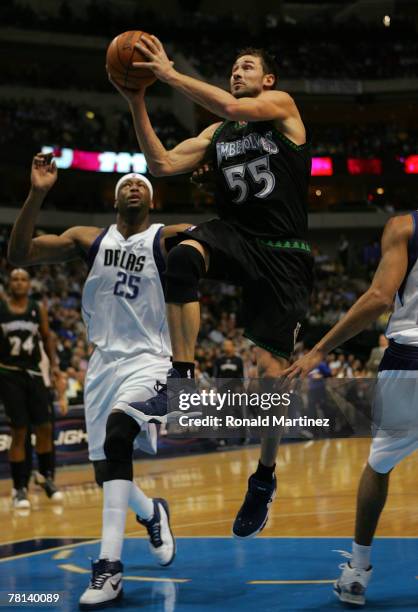 Guard Marko Jaric of the Minnesota Timberwolves takes a shot against Erick Dampier of the Dallas Mavericks on November 28, 2007 at American Airlines...