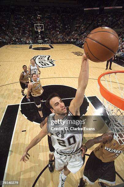 Manu Ginobili of the San Antonio Spurs shoots against Caron Butler of the Washington Wizards on November 28, 2007 at the AT&T Center in San Antonio,...