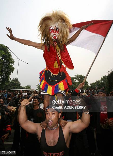 Indonesian Reog Ponorogo dancers - which is said to have been created by one of the kings of Kediri, East Java in the 12th century - hold a protest...