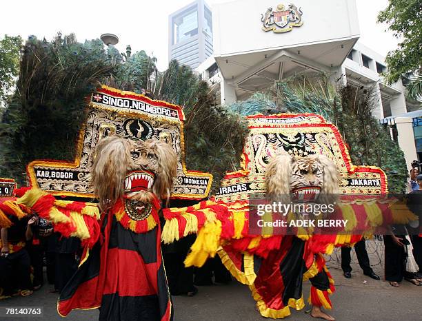 Reog Ponorogo dancers perform a dance during a protest outside Malaysia's embassy in Jakarta, 29 November 2007. Hundreds of Indonesian dancers of...