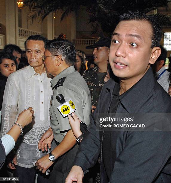 Leaders of Philippine rebel soldiers, Senator Antonio Trillanes , Army Brigadier-General Danilo Lim and former vice president Teofisto Guingona hold...