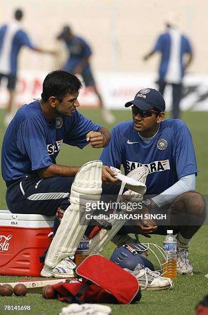 India cricketer Rahul Dravid gestures while talking with bowling coach Venkatesh Prasad during a training session on the eve of the second Test match...