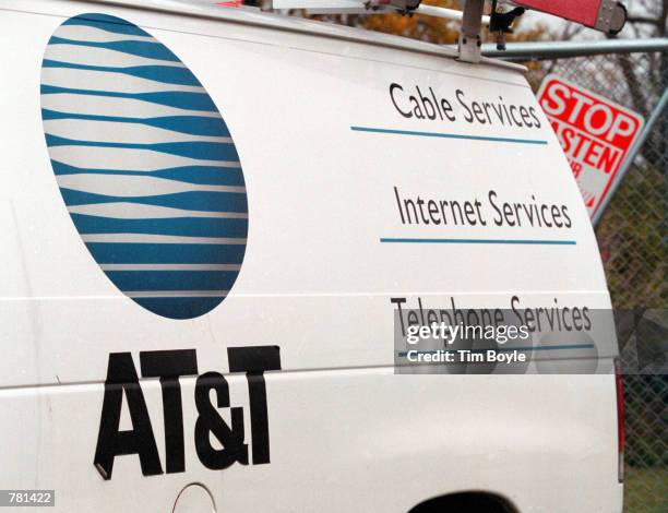 The AT&T logo is seen on the side of a service van October 26, 2000 in Des Plaines, Illinois. On October 25 AT&T Corp. Announced that it was breaking...