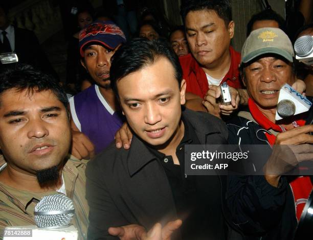 Rebel leader Antonio Trillanes, a navy lieutenant who was elected a senator, speaks to journalists while holed up at the luxury hotel in Manila's...