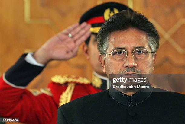 President Pervez Musharraf listens to the national anthem before taking the oath of office for a five-year term as a civilian president November 29,...