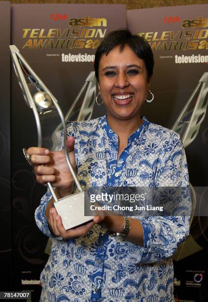 Barkha Dutt poses with the award for Best Talk Show of the Year at the Asian Television Awards 2007 at the Suntec City Convention Centre on November...