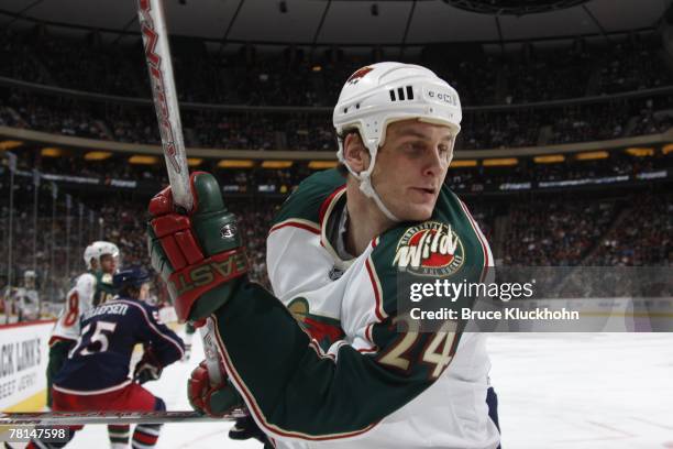 Derek Boogaard of the Minnesota Wild keeps his eyes on the puck during the game against the Columbus Blue Jackets at Xcel Energy Center on November...