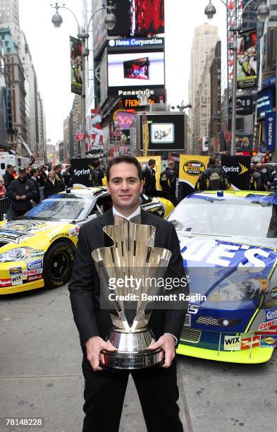 Driver Jimmie Johnson poses for a picture with the NASCAR NEXTEL Cup at the 2007 NASCAR Nextel Cup Series Jimmie Johnson signing in Times Square...
