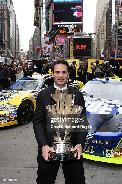 Driver Jimmie Johnson poses for a picture with the NASCAR NEXTEL Cup at the 2007 NASCAR Nextel Cup Series Jimmie Johnson signing in Times Square...