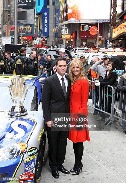 Driver Jimmie Johnson and Chandra Johnson pose for a picture during the 2007 NASCAR Nextel Cup Series Jimmie Johnson signing in Times Square November...