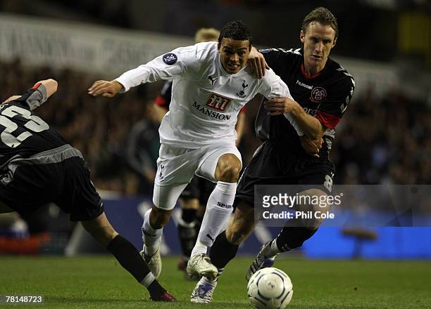 Jermaine Jenas of Tottenham battles with Andreas Johansson of Aalborg during the Uefa Cup match between Tottenham Hotspur and Aalborg BK at White...