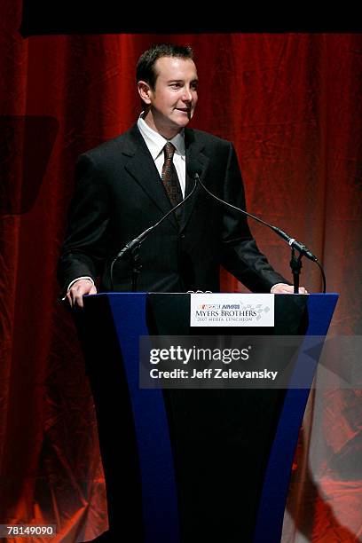 Kurt Busch, driver of the Miller Lite Dodge, speaks after receiving an award during NASCAR Champions Week NMPA Myers Brothers Media Luncheon at...