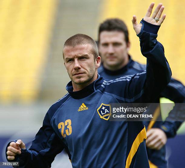 David Beckham of the LA Galaxy waves to the crowd of thousands who attended the team's open training session in at Westpac Stadium in Wellington, 30...