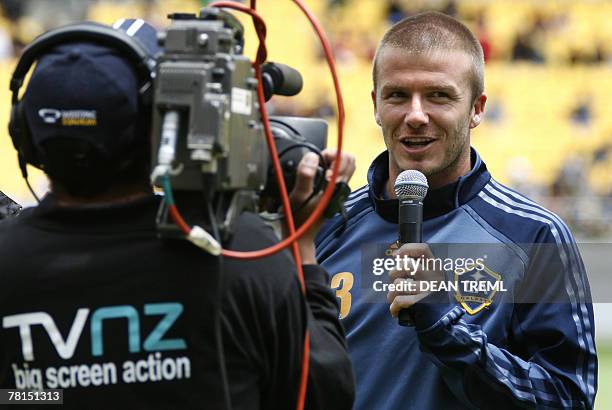 David Beckham of the LA Galaxy speaks to the crowd of thousands who attended the team's open training session in at Westpac Stadium in Wellington, 30...