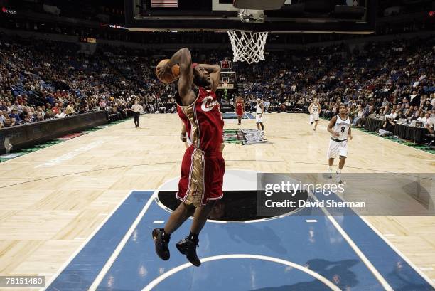 LeBron James of the Cleveland Cavaliers elevates for a dunk during the game against the Minnesota Timberwolves at the Target Center on November 21,...
