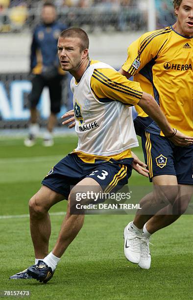 David Beckham of the LA Galaxy trains in front of a crowd of thousands who attended the team's open training session in at Westpac Stadium in...