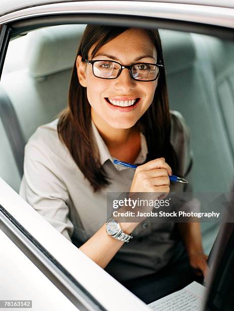 businesswoman in a car - boardmember stockfoto's en -beelden