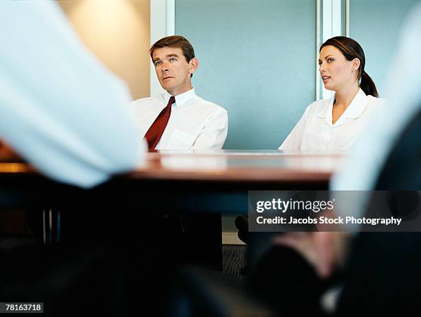 business managers in a boardroom meeting - verwaltungsrat stock-fotos und bilder
