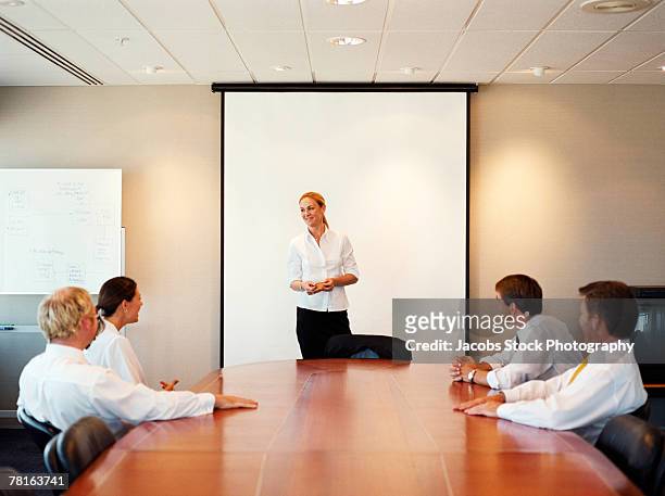 meeting in the boardroom - boardmember stockfoto's en -beelden