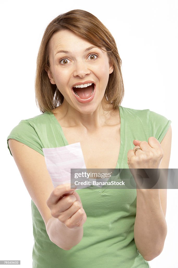 Woman with lottery ticket