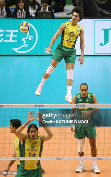 Brazilian volleyball star Gilberto Godoy Filho "Giba" serves against Argentina during their match at the FIVB Men's World Cup volleyball tournament...