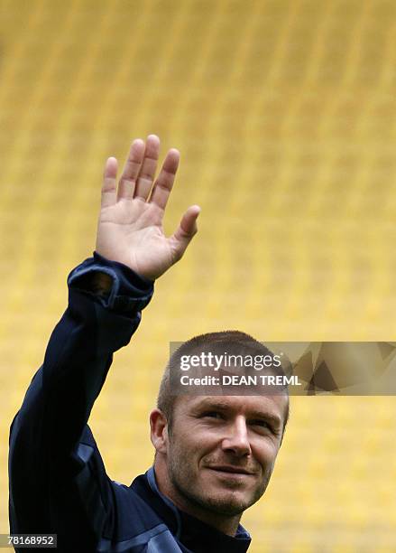 David Beckham of the LA Galaxy waves to the crowd of thousands who attended the team's open training session in at Westpac Stadium in Wellington, 30...