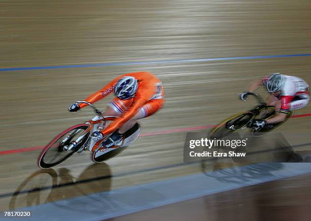 Willy Kanis of the Netherlands, races past Anna Meares of Australia, racing for Team Toshiba, to win the women's sprint final during day one of the...