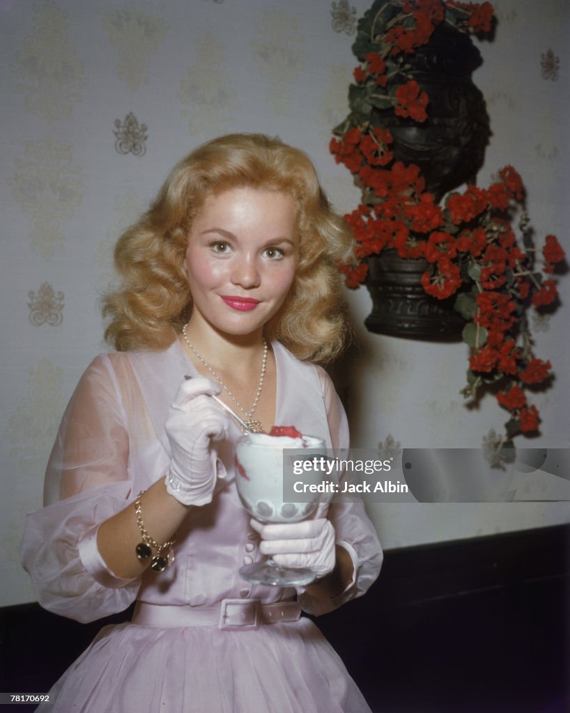 American actress Tuesday Weld enjoys an ice cream sundae, circa 1965
