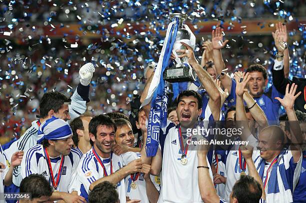 Traianos Dellas of Greece lifts the trophy during the UEFA Euro 2004 Final match between Portugal and Greece at the Luz Stadium on July 4, 2004 in...