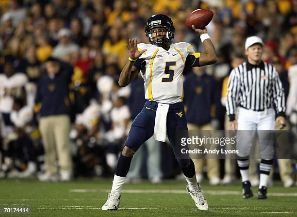 Patrick White of the West Virginia Mountaineers looks to pass the ball during the Big East Conference game against the Cincinnati Bearcats at Nippert...