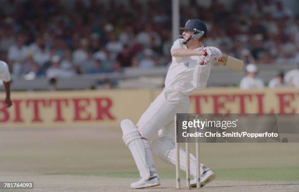 English cricketer Dominic Cork of the England cricket team pictured in action batting for England against West Indies during the 5th Test Match at...